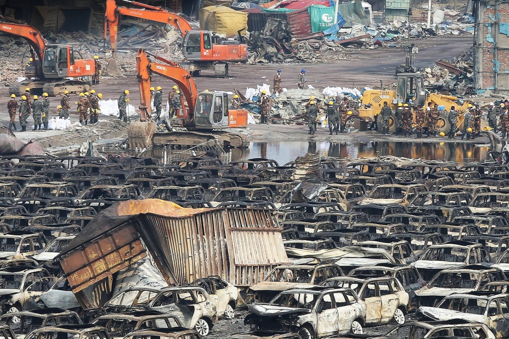 Thousands of wrecked cars and containers litter the blast site in Tianjin, where officials are involved in a desperate search for spilled sodium cyanide. Photo: KY Cheng