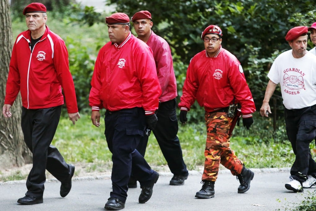 Guardian Angels founder Curtis Sliwa leads members through Central Park for the first time in over two decades, citing a 26 percent rise in crime there so far this year. Photo: AP