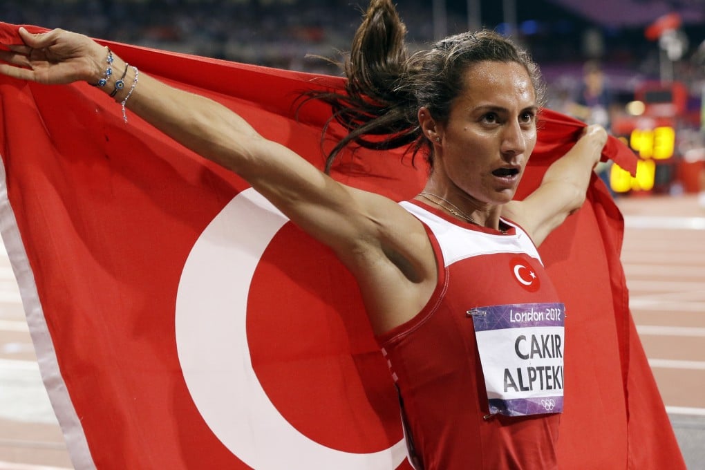 Asli Cakir Alptekin celebrates after winning the women's 1,500 metres gold medal at the 2012 London Olympic Games. She has been stripped of the medal and banned for eight years for doping. Photos: AP