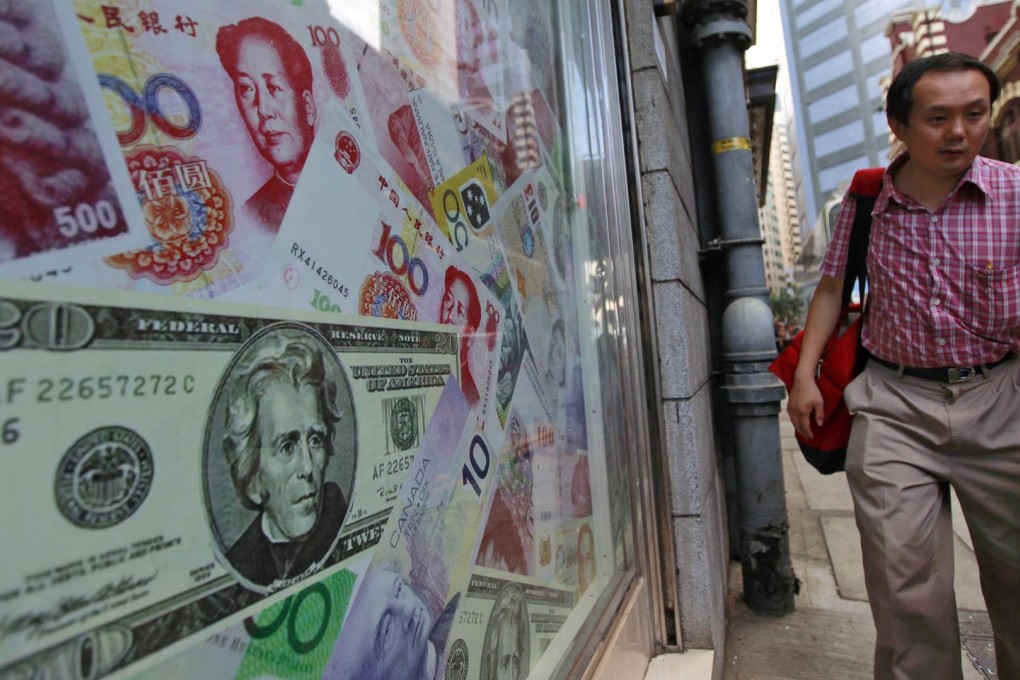 With an outstanding debt of US$1.7 trillion, mainland companies will have to earn more yuan to finance or clear their dollar debts after last week's devaluation. Photo: EPA