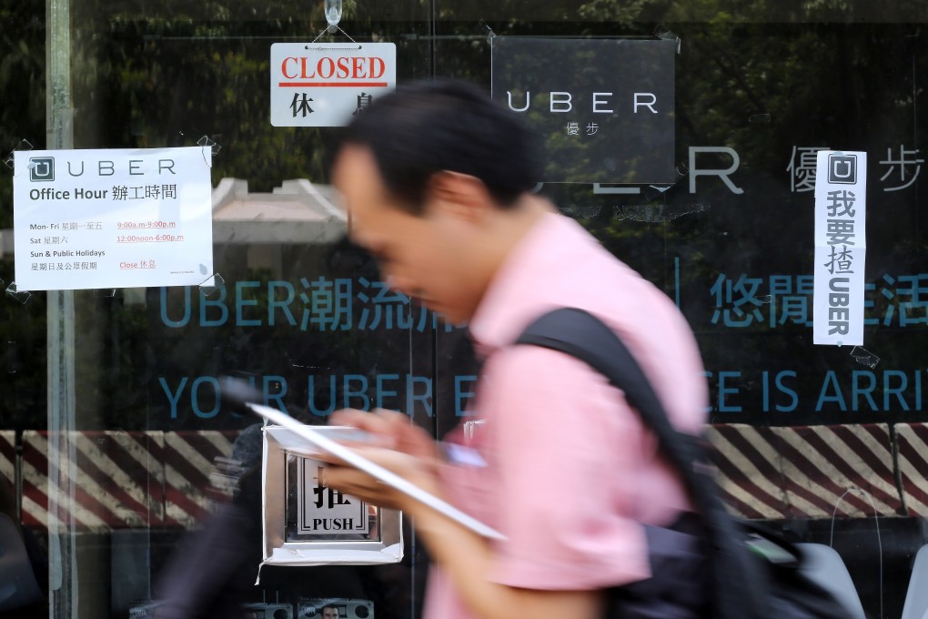 Taxi-and-car-hailing app Uber was raided by Hong Kong police amid claims drivers were unlicensed and lacked proper insurance. Photo: Edward Wong