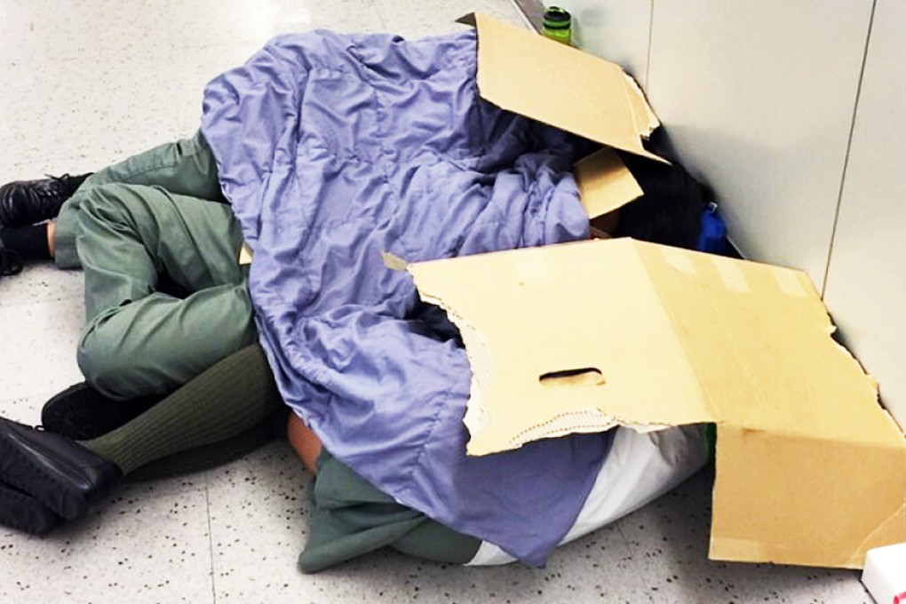 Four blankets were available to the entire group during its overnight stay, according to Hong Kong media reports, while photographs apparently showed scouts using torn-up cardboard boxes to sleep beneath. Photo: SCMP Pictures