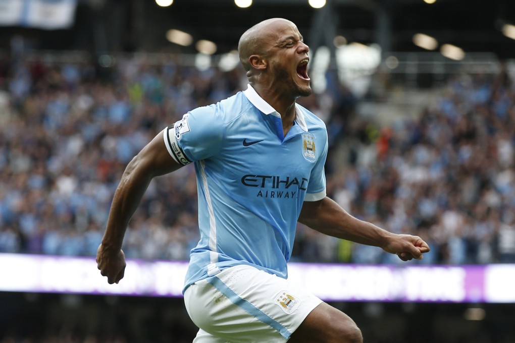 Vincent Kompany celebrates after scoring the second goal for Manchester City in their 3-0 win over Chelsea at the Etihad Stadium. Photos: Reuters
