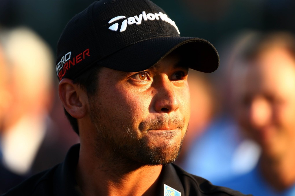 Jason Day holds back the tears as he comes to terms with his achievement. Photo: AFP