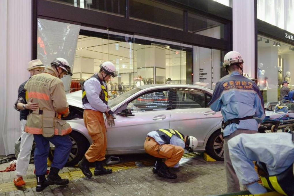 Emergency workers attend the scene of the fatal incident in Tokyo on Sunday night. Photo: Kyodo