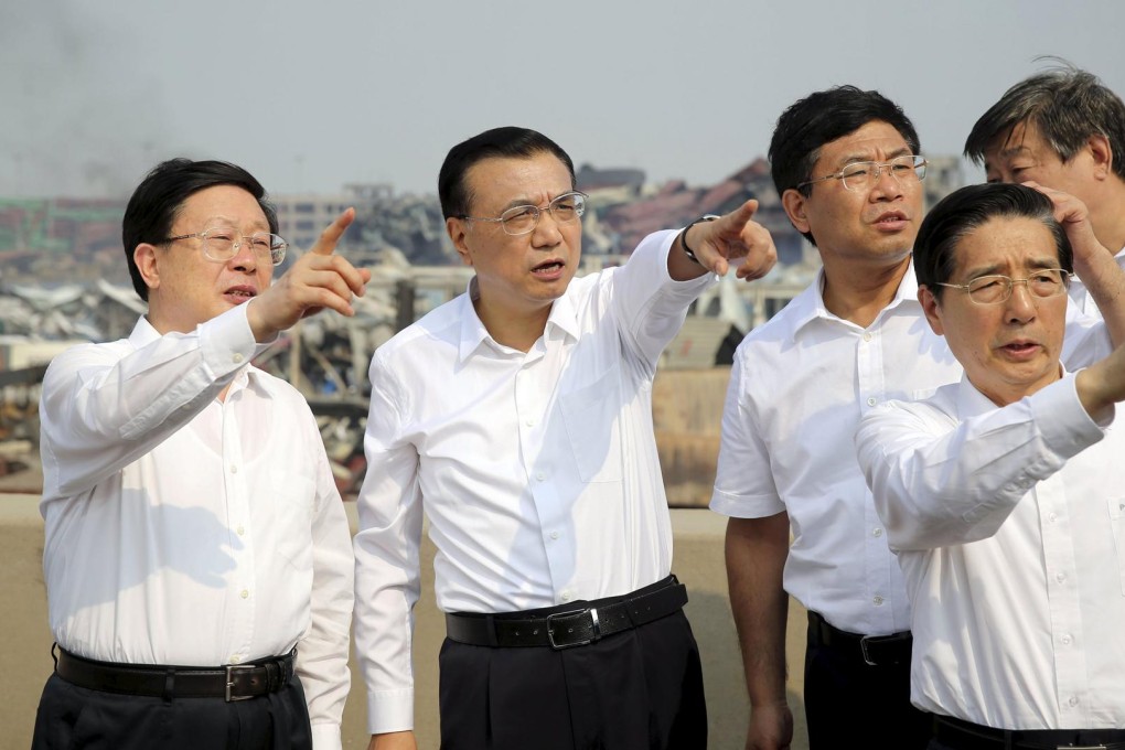 Premier Li Keqiang, second from left, visits the blast site on Sunday. Photo: Reuters