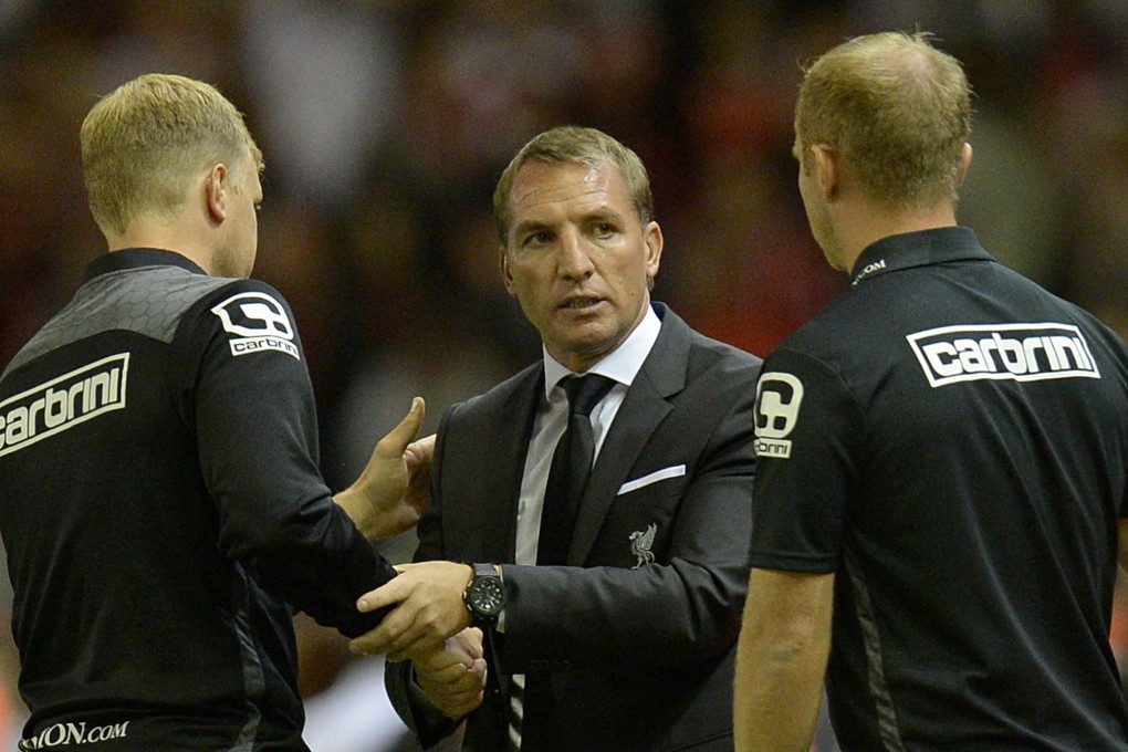 Liverpool manager Brendan Rodgers (centre) speaks with Bournemouth manager Eddie Howe (left) at the end of their Premier League match. Photo: AFP