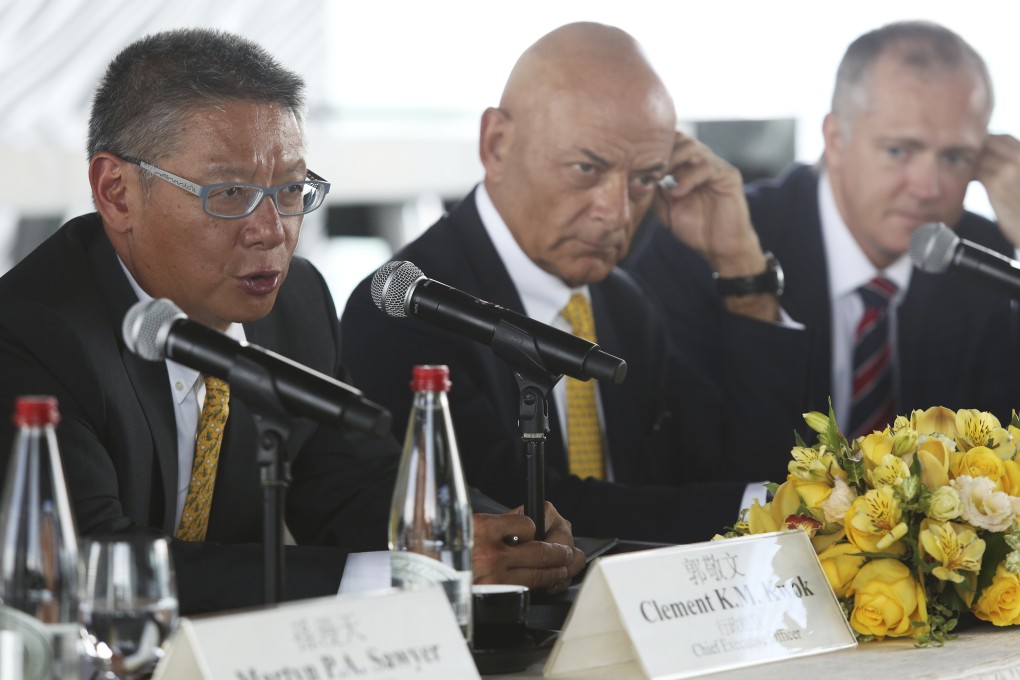 Chief executive Clement Kwok, chief operation officer Peter Borer and chief financial officer Alan Clark announce the company's 2015 interim results. Photo: Sam Tsang