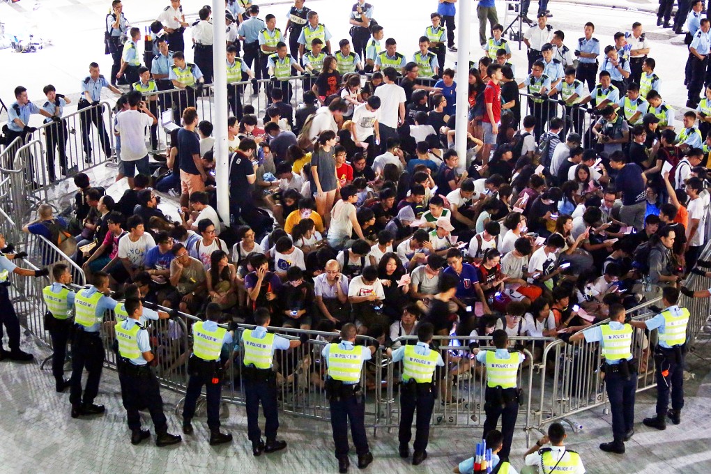 Around 100 protesters broke into the 'Civic Square' forecourt outside government headquarters in Admiralty on September 26, 2014. Photo: Sam Tsang