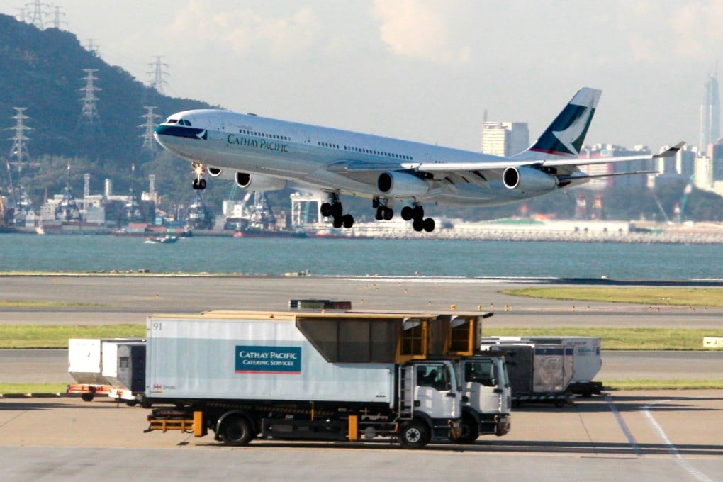 A Cathay Pacific Airways passenger plane takes off at the Hong Kong International Airport as the company is expected to report results on Wednesday. Photo: May Tse
