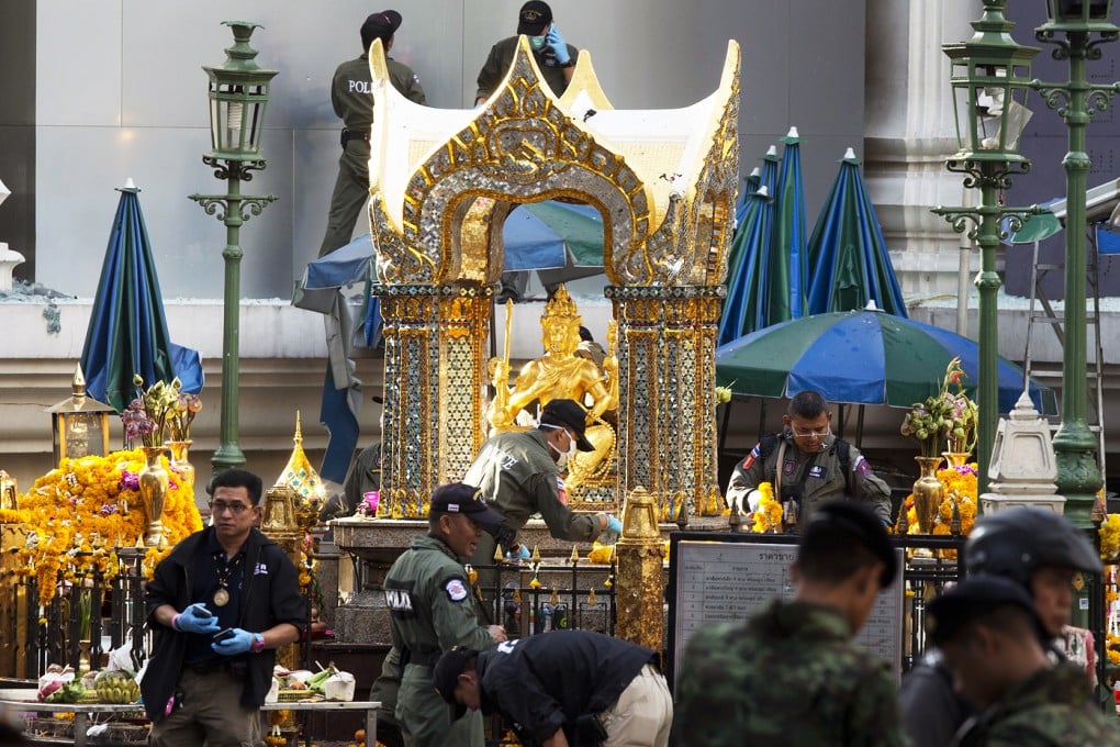 Police investigate the scene around the Erawan Shrine the morning. Photo: AP