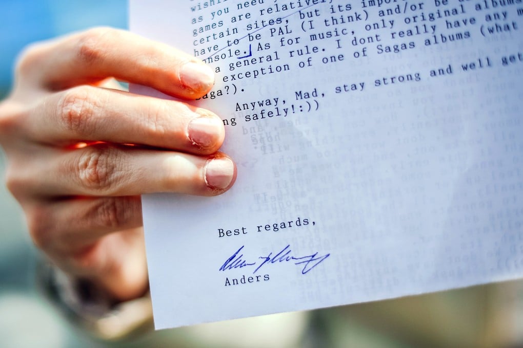Victoria (pseudonym), in her mid-20s, shows a letter sent to her and signed by Anders Breivik in Stockholm. Victoria claims Anders Behring Breivik is her best friend. Photo: AFP
