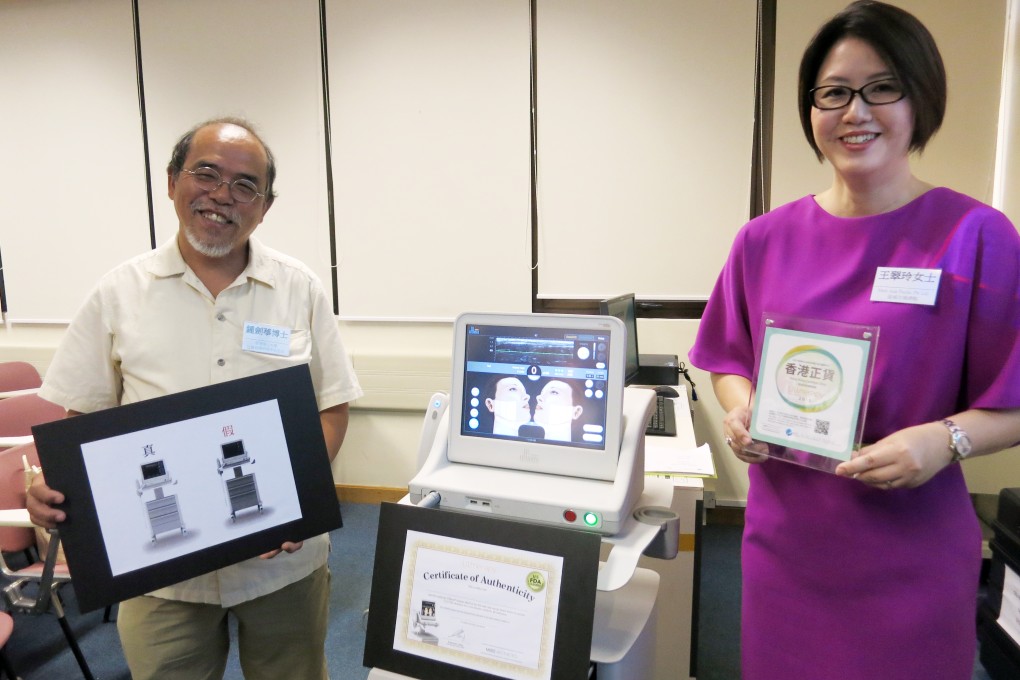 Dr Chung Kim-wah (left) and Sarah Wong highlight the differences between real and fake beauty machines. Photo: SCMP Pictures