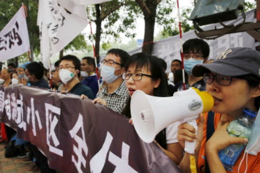 About 150 homeowners protest, saying the government's compensation for their homes, destroyed by the Tianjin blasts, was insufficient. Photo: Reuters