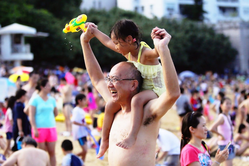 Swimmers relax on the Stanley Main Beach while Very Hot Weather Warning has been issued by the Hong Kong Observatory. Photo: Sam Tsang