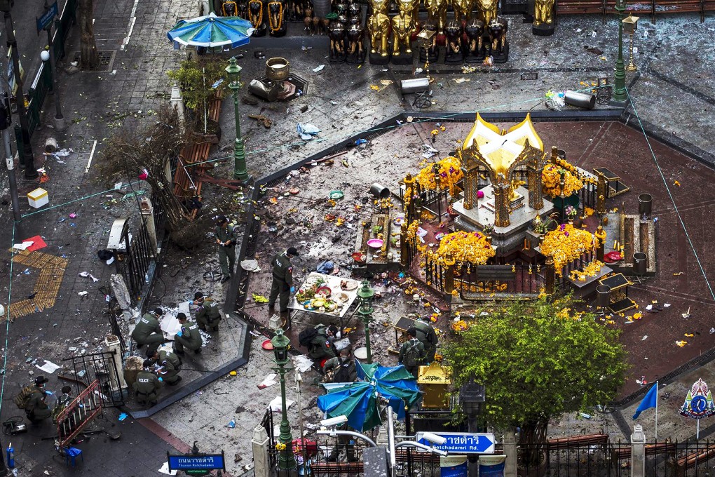 Experts look for clues yesterday at the Erawan Shrine in central Bangkok, site of the blast on Monday that killed 20 people. Photo: Reuters