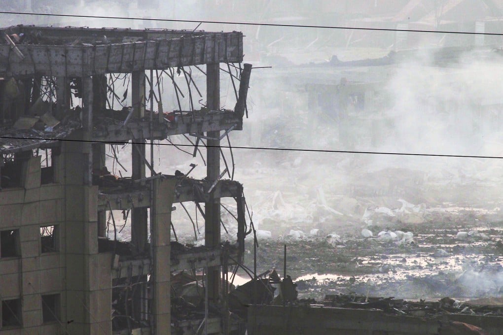 Smoke rises amid the devastation caused by the blasts in Tianjin. Photo: SCMP Pictures