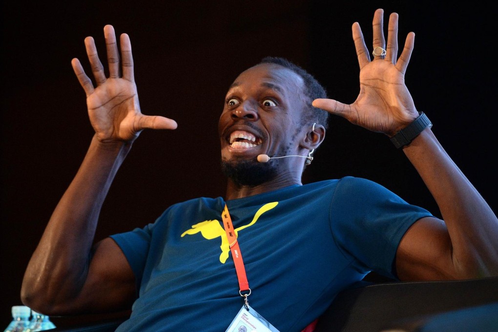 Jamaican sprint superstar Usain Bolts strikes a funny pose at a press conference ahead of the World Championships in Beijing. Photos: AFP