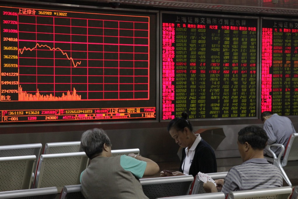 Investors mill around a brokerage firm as they watch stock prices in China as business confidence in the country is at its highest level in a year. Photo: EPA