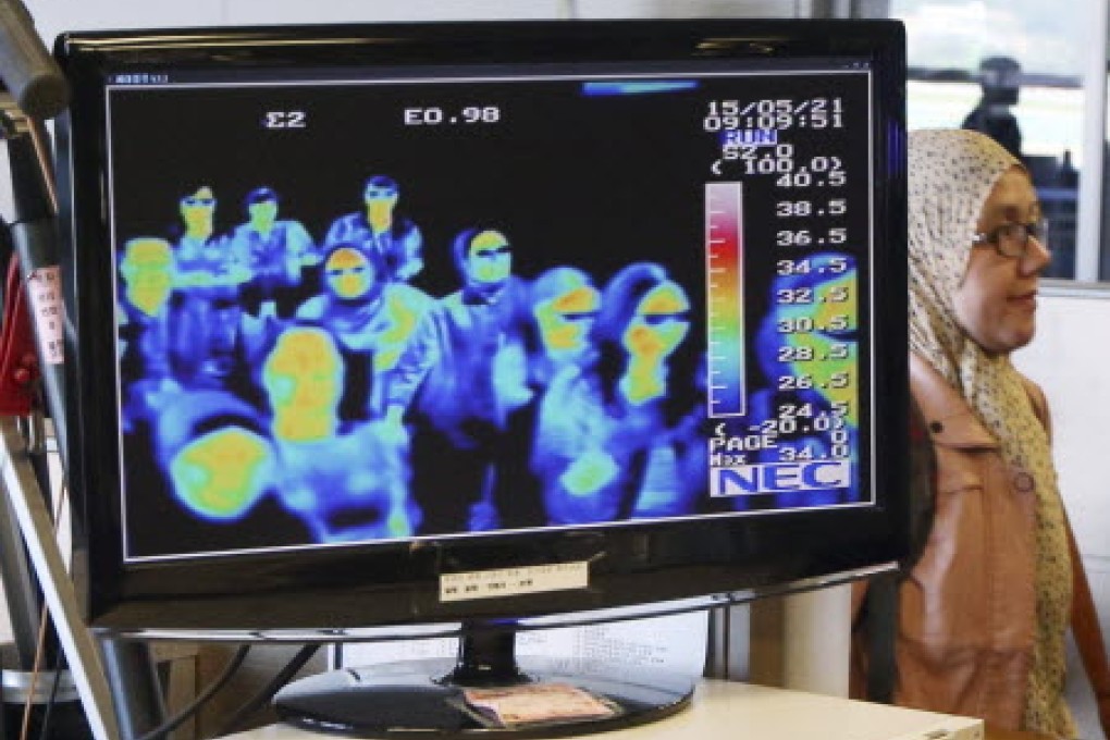A thermal camera monitor shows the body temperature of passengers arriving from overseas against possible Mers. Photo: AP