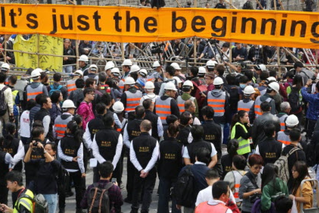 Students fighting for universal suffrage during the Umbrella Movement stood ready to be arrested for their cause. Photo: Felix Wong