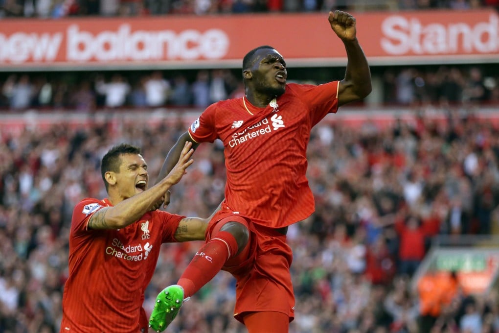 Christian Benteke celebrates scoring for Liverpool. His goal was offside by a country mile under a change to the offside rule this season. Photo: AP