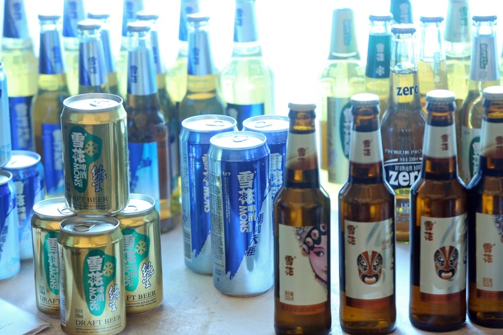 Bottles and canned versions of Snow Beer are displayed as China Resources Enterprise reported its interim results on Friday. Photo: Sam Tsang