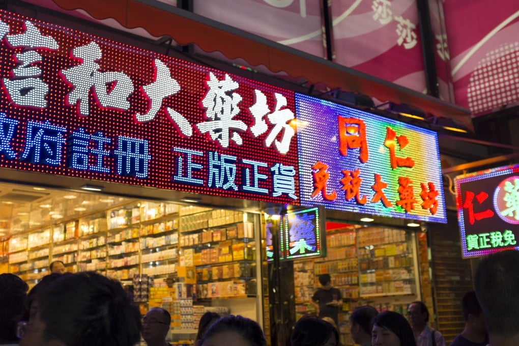 Many drug stores have sought to pass off as government-registered dispensaries by putting up signs that resemble the universally recognised symbol of "Rx." Photo: Antony Dickson