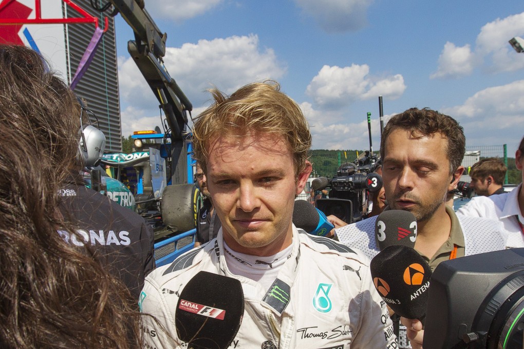 Mercedes driver Nico Rosberg reacts in the pit lane after suffering a tyre failure during a free practice session. Photo: Reuters