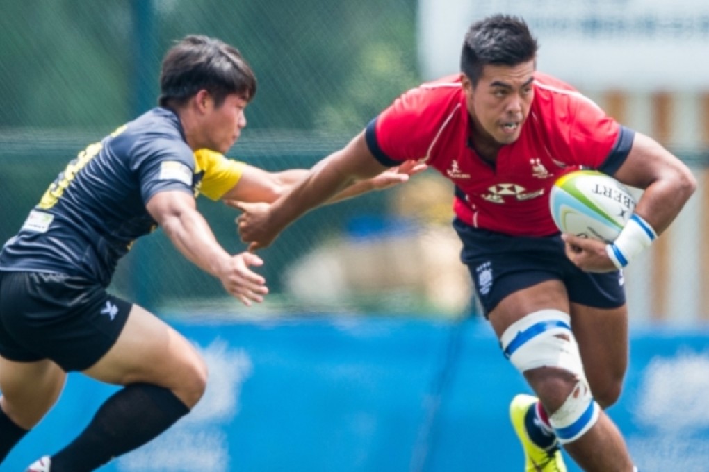 Hong Kong captain Richard Lewis leads from the front on the first day of the second leg of the 2015 Asia Rugby U20 Sevens Series at King's Park on Friday. Photo: HKRU