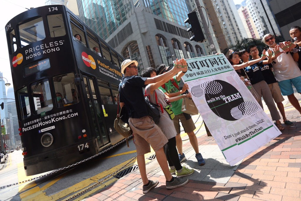Petitioners rally from Western Market in Sheung Wan to Pedder Street in Central to save the tram. Photo: SCMP Pictures