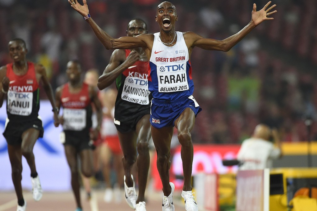 Mo Farah celebrates as he wins a pulsating 10,000m race on the first day of the world athletics championships in Beijing. Photos: AFP