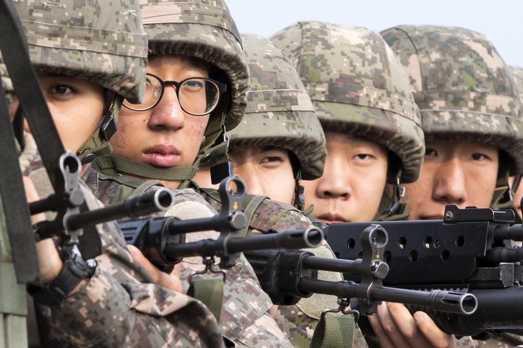 South Korean soldiers ride a truck to Panmunjom. Photo: AFP