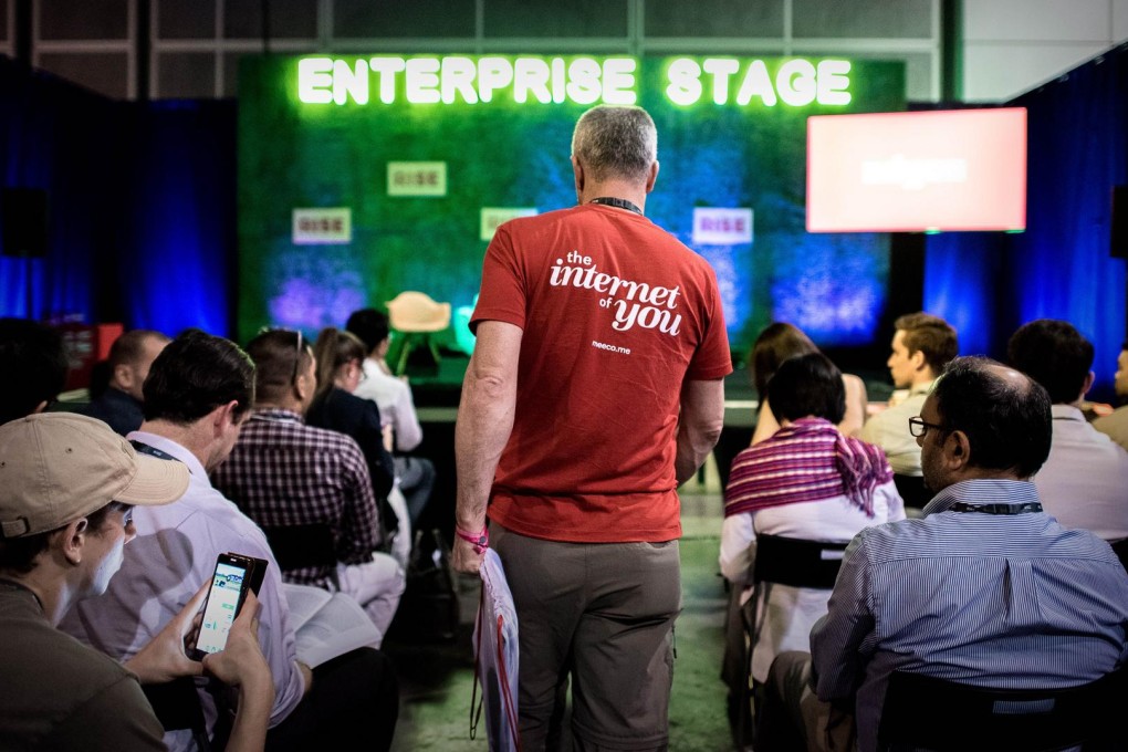 Visitors and participants wait for a talk to start at the RISE technology conference in Hong Kong on July 31. Photos: Agence France-Presse, K. Y. Cheng, Bloomberg