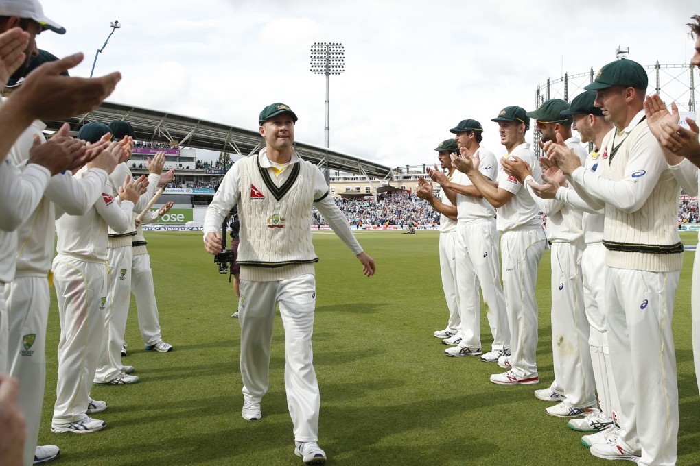 Australia captain Michael Clarke receives a guard of honour from his teammates as he leaves the field after Australia won the fifth test at The Oval. Photo: AP