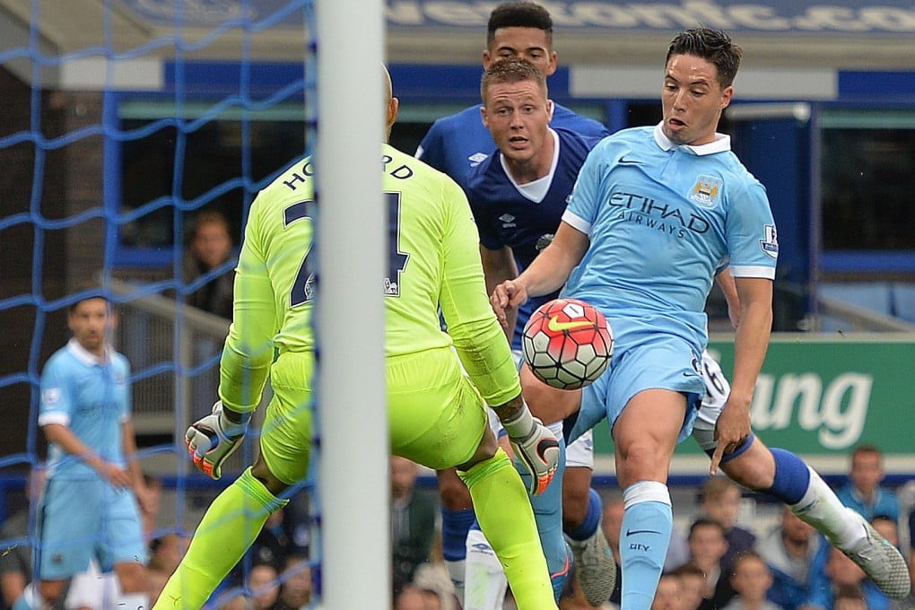 Samir Nasri scores Manchester City's second goal. Photo: EPA