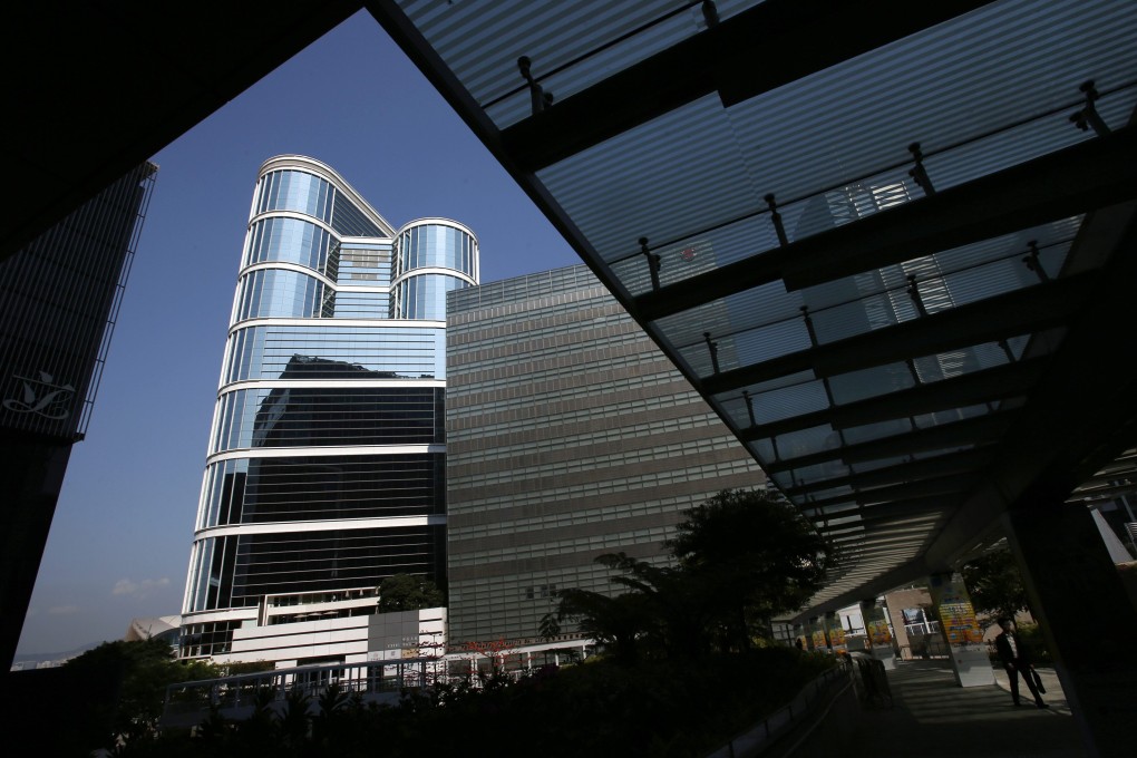A man walks on a footbridge outside CITIC Tower as Citic, mainland China’s largest state-backed conglomerate, posted a 46 per cent rise in net profit for the year’s first six months. Photo: Reuters