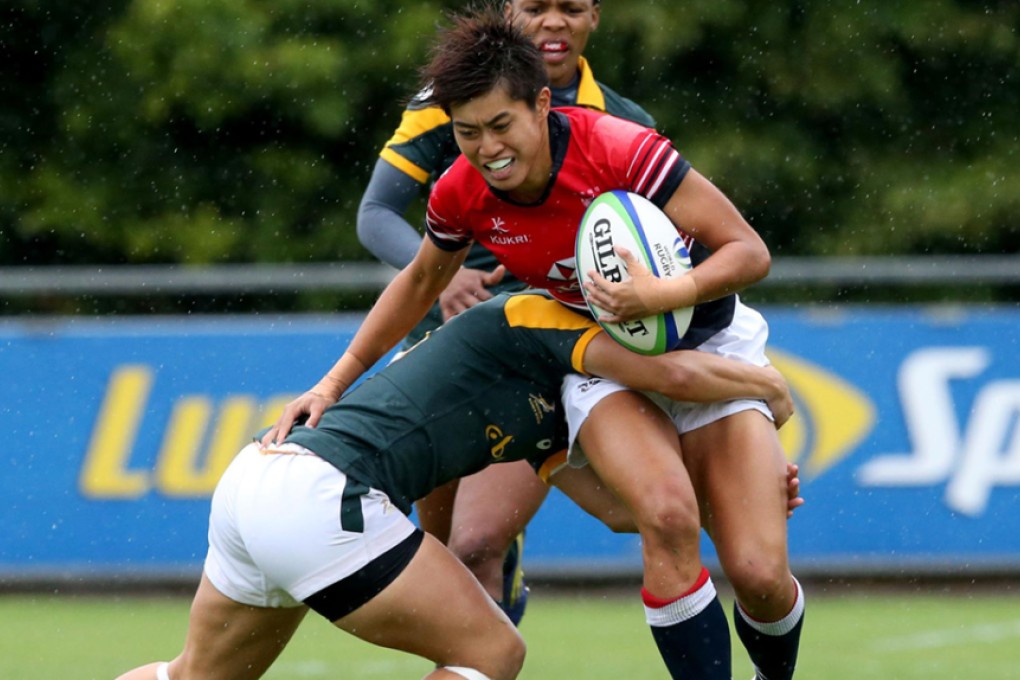 Aggie Poon Pak-yan – scorer of eight Hong Kong tries at the World Rugby Women’s Sevens Series qualifiers in Dublin at the weekend – runs into the South African defence. Photos: World Rugby