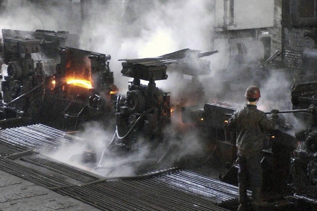 A worker operates machinery at a steel refinery in Liaoning province, once the country's fastest-growing region but now an economic laggard. Photo: Xinhua