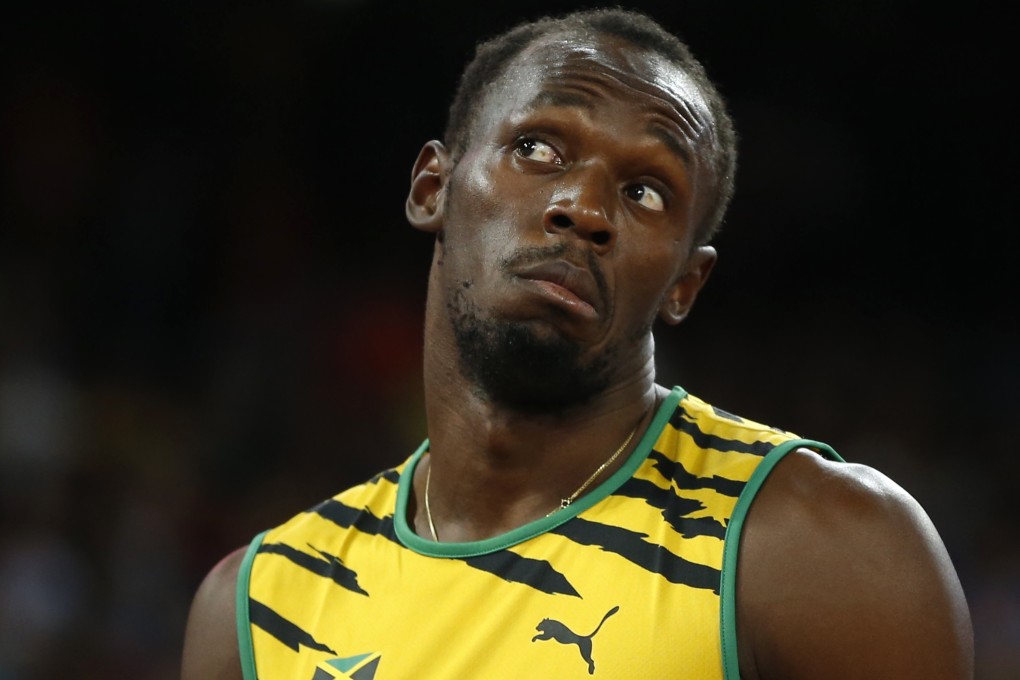 Presure? What pressure? Usain Bolt in a confident mood on the track for the men's 200m heats at the world athletics championships in Beijing. Photo: Reuters