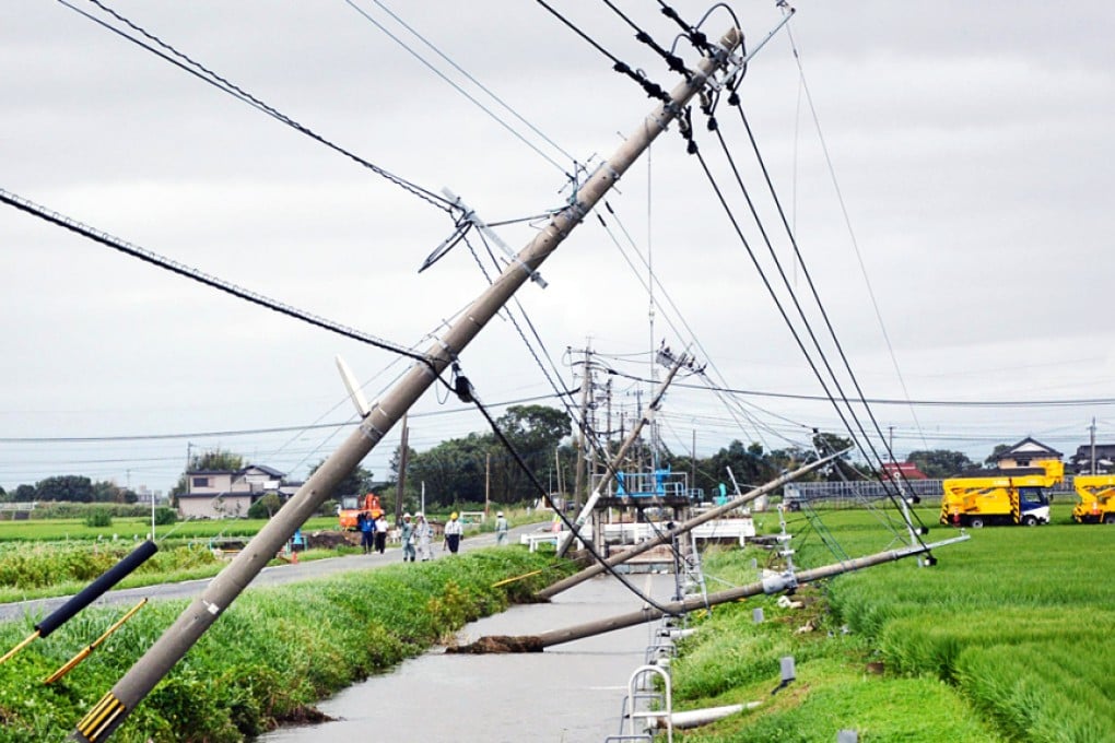 Power poles damaged due to strong winds caused by Typhoon Goni in Kamimine town, Saga Prefecture, Japan on August 25, 2015. Photo: Kyodo