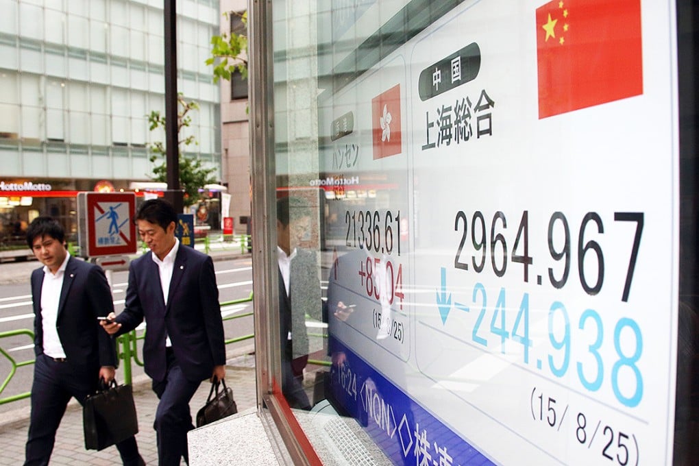 A securities firm in Tokyo displays China stocks. The PBOC cut interest rates after the Shanghai Composite Index closed more than 7 per cent down. Photo: Bloomberg