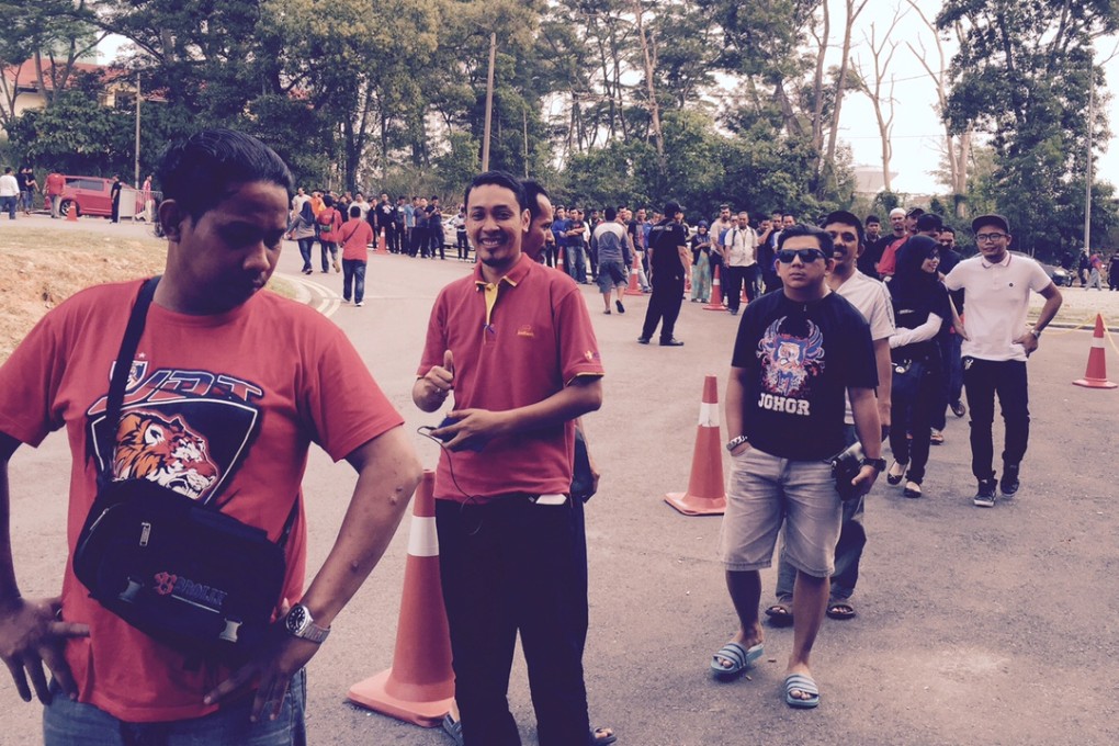 Johor Darul Ta'zim fans queue up at 9am for tickets to watch their team against South China in the AFC Cup. Photos: SCMP Pictures