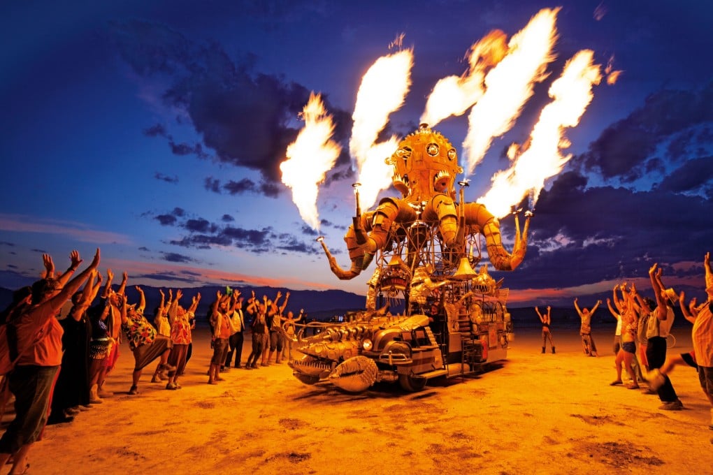Revellers salute “El Pulpo Mecanico”, a creation by Duane Flatmo and Jerry Kunkel from 2014. Photos: NK Guy/Taschen