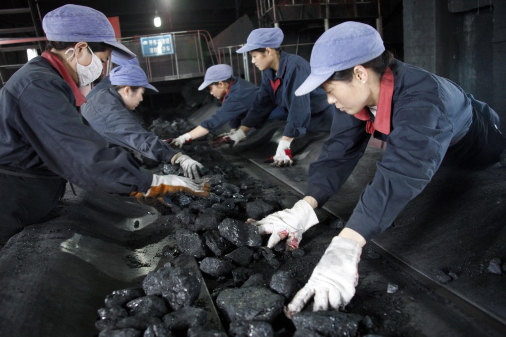 Workers sort coal at a mine in Anhui province in eastern China. The nation is the world's main user of the fuel and the biggest producer of greenhouse gases. Photo: Reuters
