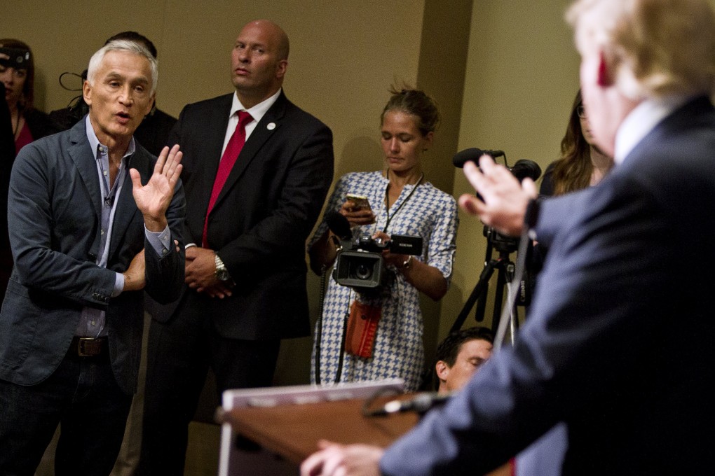 Republican presidential candidate Trump spars with Univision reporter Ramos before his "Make America Great Again Rally". Photo: Reuters
