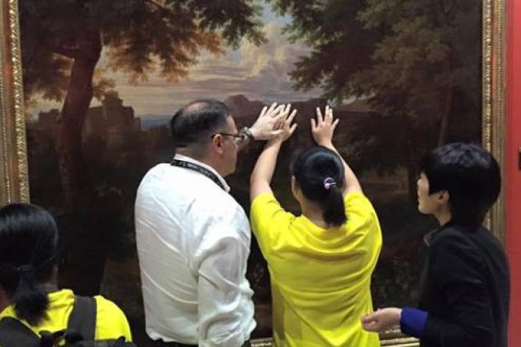 Visually impaired students are reportedly shown "experiencing art" at the Taipei exhibition. Photo: SCMP Pictures