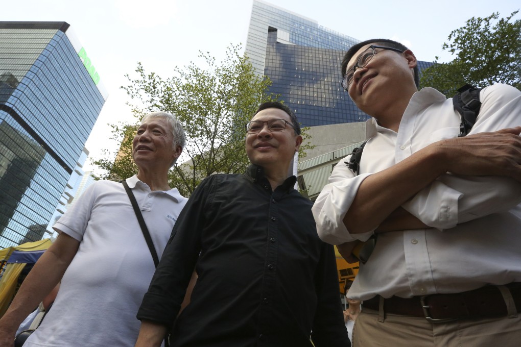 (From left to right) Occupy Central co-founders Reverend Chu Yiu-ming, Benny Tai Yiu-ting and Chan Kin-man appear outside the Legco in Tamar. Photo: Felix Wong