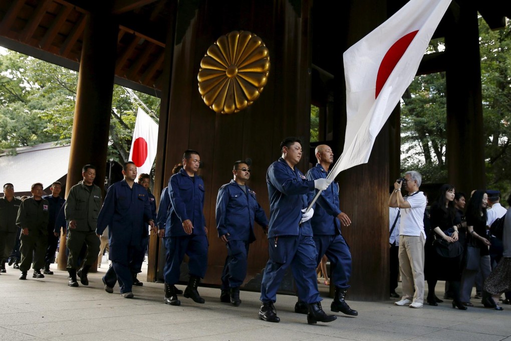 Activists in Tokyo protest at the Yasukuni Shrine on the anniversary of Japan's surrender in the second world war. Photo: Reuters