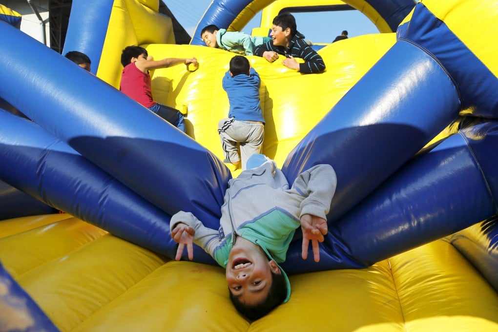Children play at a public square in Valparaiso, Chile. Photo: Reuters